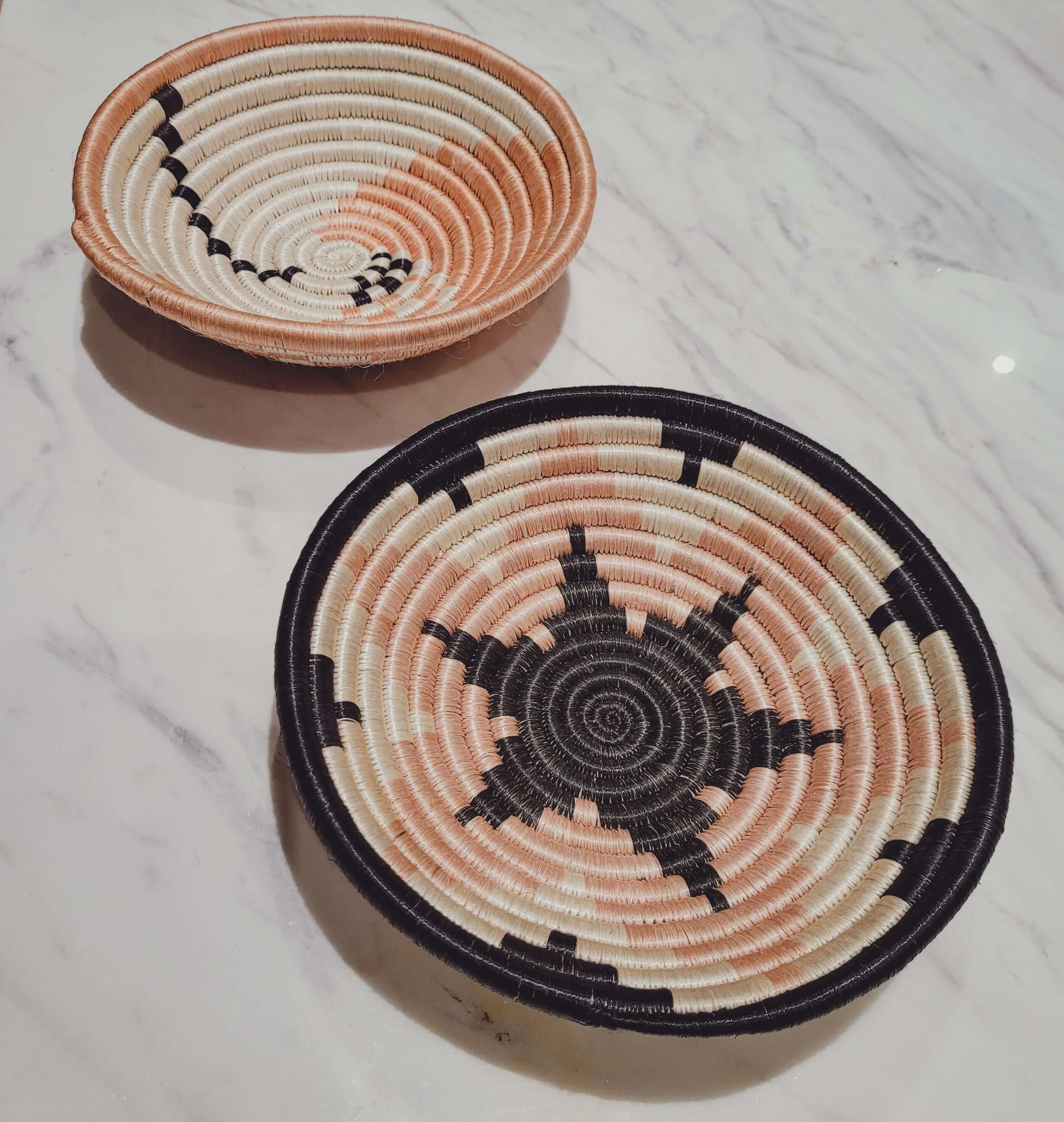 Two small woven seagrass bowls