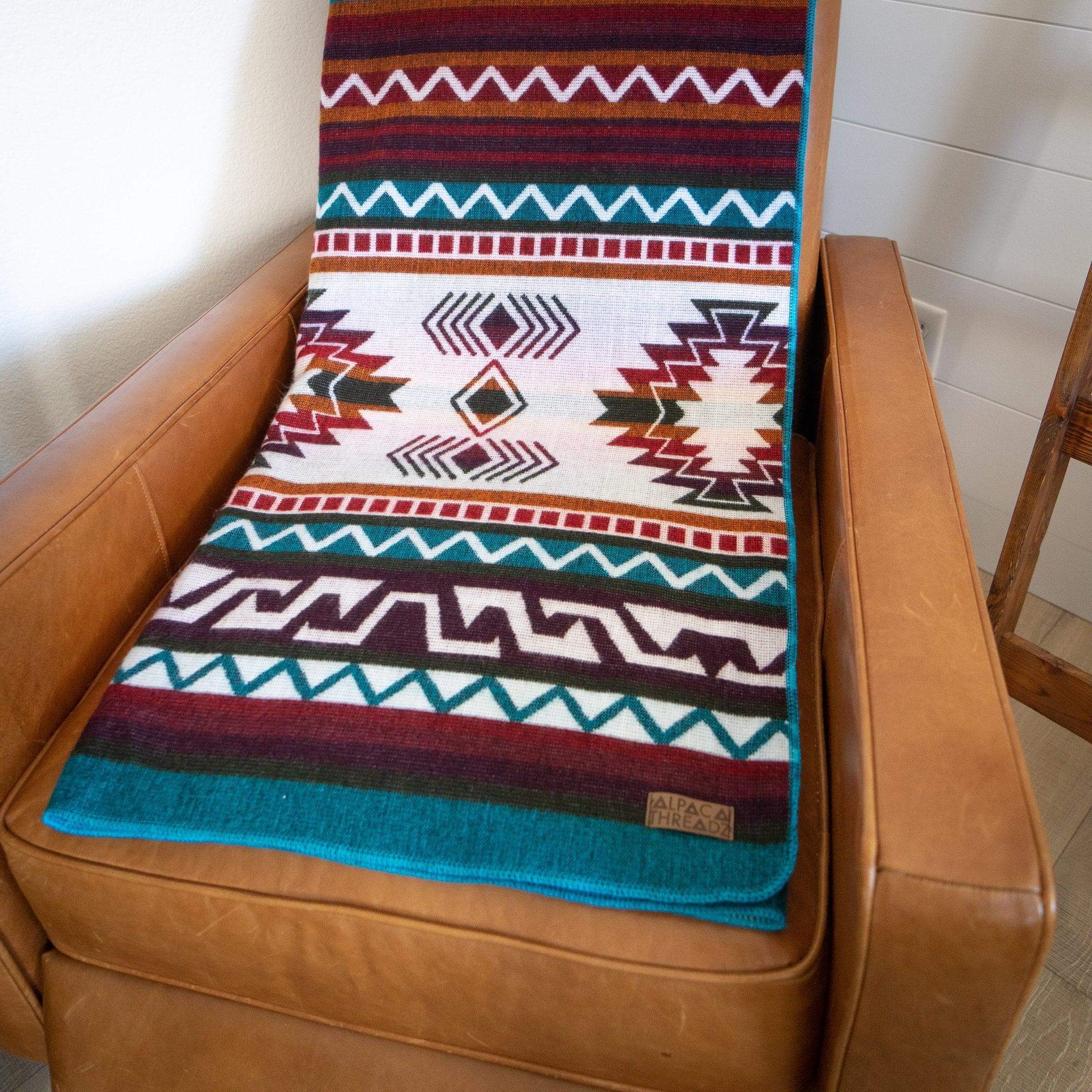 Alpaca blanket on brown armchair