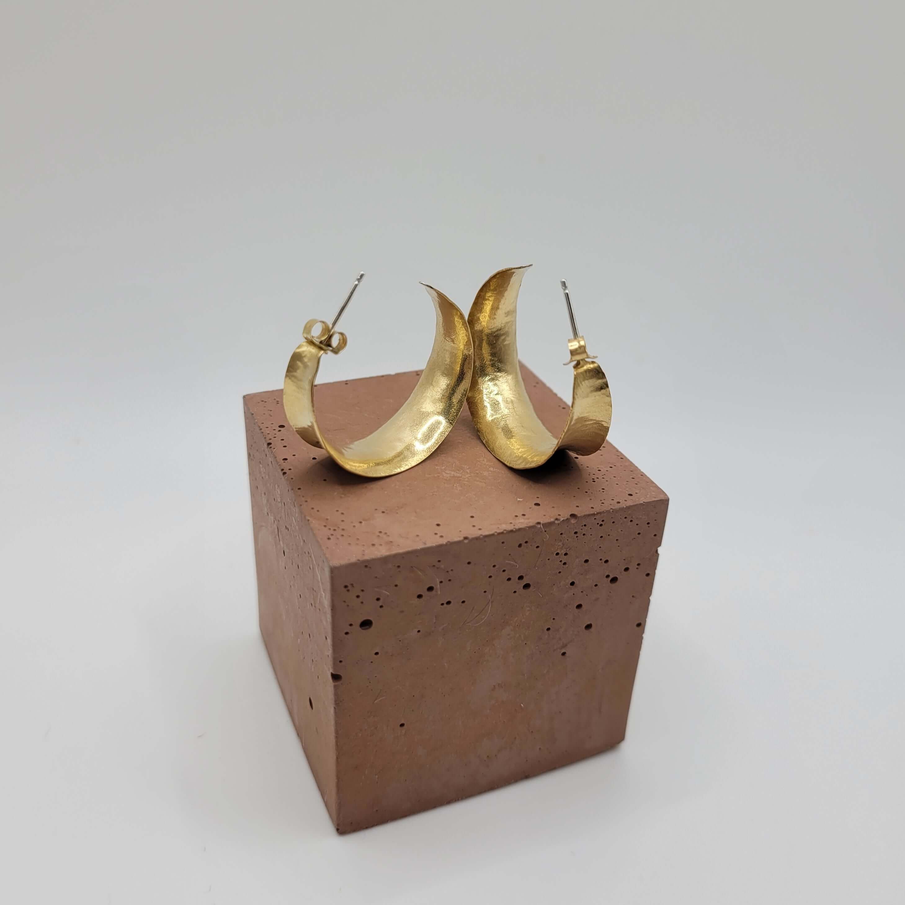 Tazara Brass Hoop Earrings on stone