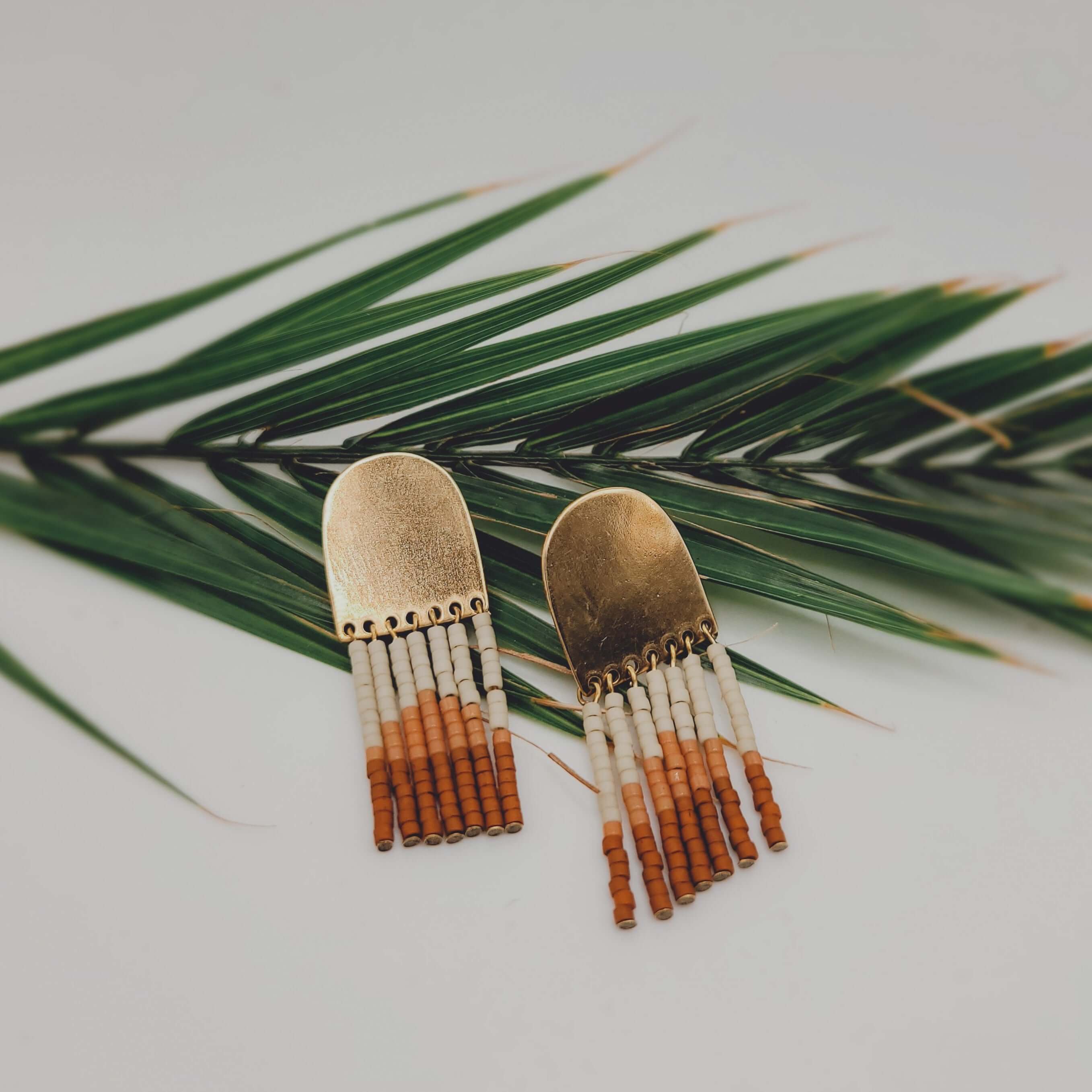 Makola Beaded Earrings on palm leaf