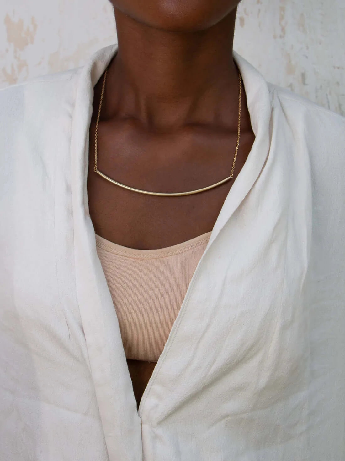 Sitima Brass Necklace on model with white shirt