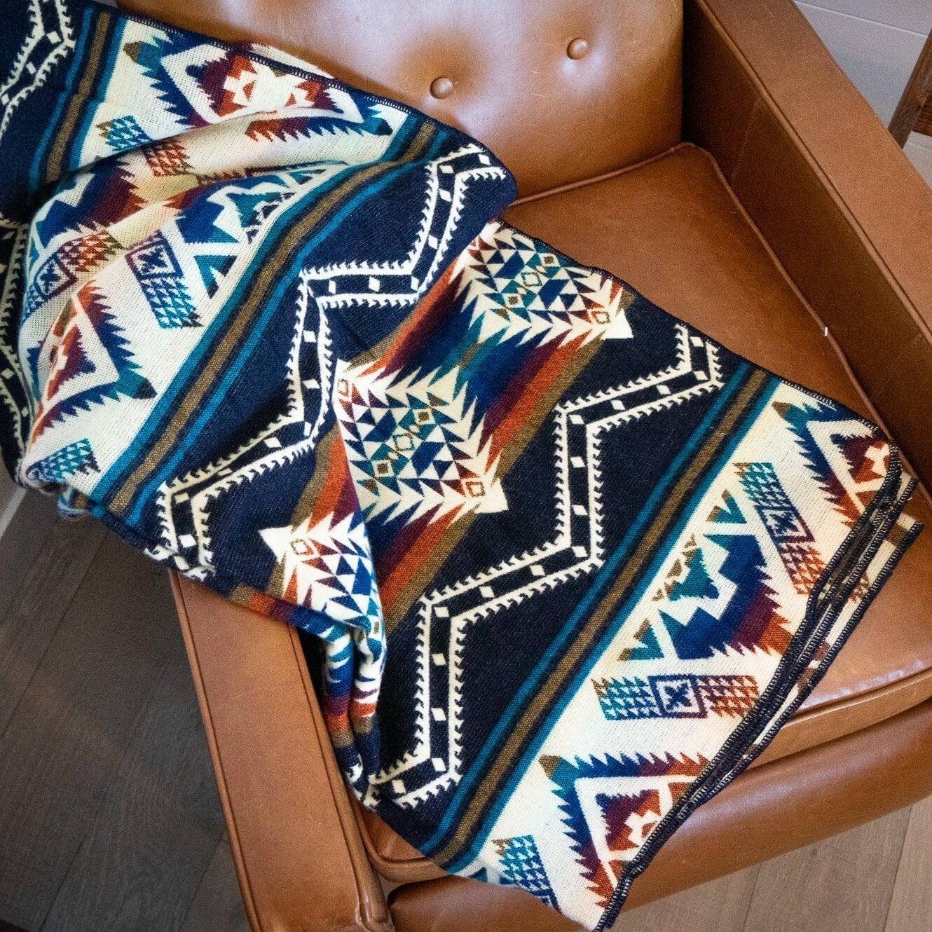 Boho alpaca blanket on leather armchair